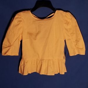 Iky & Me Top With Playful Ruffle Hem Featuring A Flattering Round Neckline